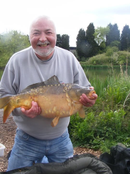 Simon's dad fishing beside the lake